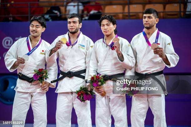 Silver medallist Japan's Soichi Hashimoto, gold medallist Uzbekistan's Murodjon Yuldoshev, bronze medallists Mongolia's Tsend-Ochiryn Tsogtbaatar and...
