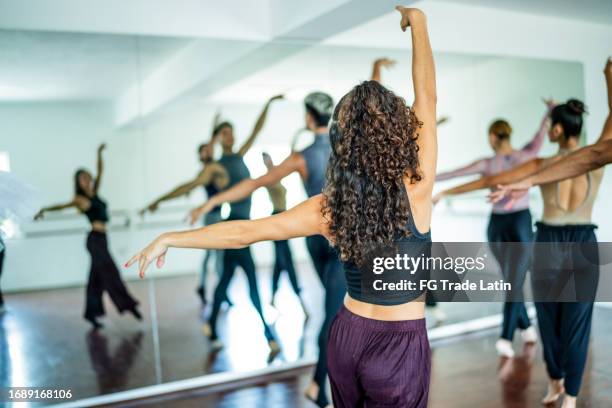 rear view of a woman dancing at dance studio - jazz dancing stock pictures, royalty-free photos & images