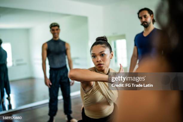 young woman dancing at the dance studio - jazz dancing stock pictures, royalty-free photos & images