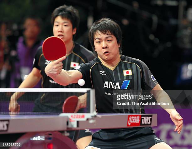 Jun Mizutani and Seiya Kishikawa of Japan compete against Adrian Crisan and Andrei Filimon of Romania in the Men's Doubles 2nd round during day four...