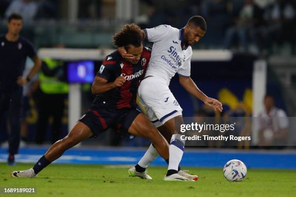 Joshua Zirkzee of Bologna and Isak Hien of Verona compete for the ball during the Serie A TIM match between Hellas Verona FC and Bologna FC at Stadio...