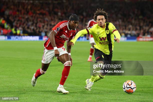 Anthony Elanga of Nottingham Forest battles for possession with Luca Koleosho of Burnley during the Premier League match between Nottingham Forest...