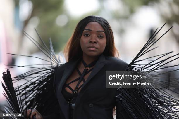 Suzan Mutesi seen wearing a Brendan De La Hay black outfit with details, and a black blazer during London Fashion Week September 2023 on September...