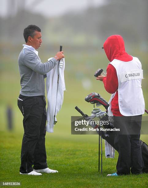 Christophe Brazillier of France wipes his golf club at the 11th hole during Day Two of the Madeira Islands Open - Portugal - BPI at Club de Golf do...