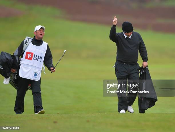 Chris Doak of Scotland receives congratulations after holing out from 180 yards on the 11th hole during Day Two of the Madeira Islands Open -...