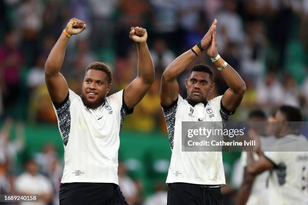 Tevita Ikanivere and Ilaisa Droasese applaud after the Rugby World Cup France 2023 match between Australia and Fiji at Stade Geoffroy-Guichard on...