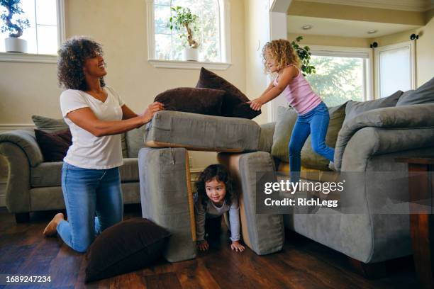 children playing in a home living room on a play date - play date stock pictures, royalty-free photos & images