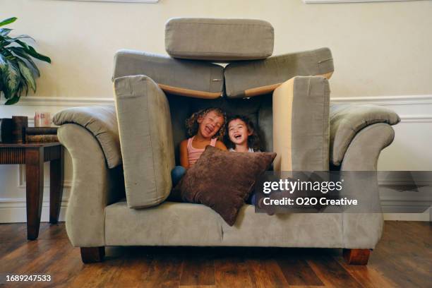 children playing in a home living room on a play date - fortress stock pictures, royalty-free photos & images