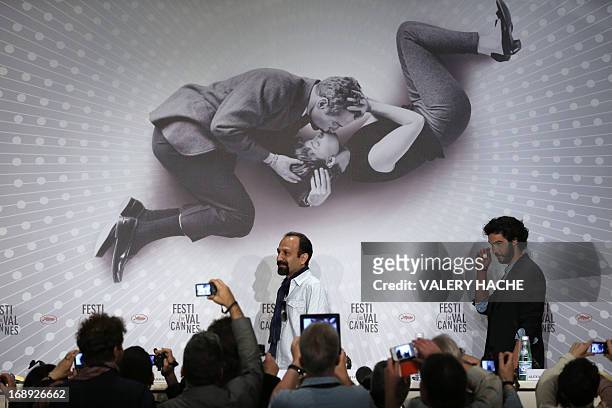 Iranian director Asghar Farhadi and French actor Tahar Rahim arrive on May 17, 2013 for a press conference for the film "The Past" presented in...