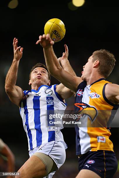 Brent Harvey of the Kangaroos marks the ball against Adam Selwood of the Eagles during the round eight AFL match between the West Coast Eagles and...