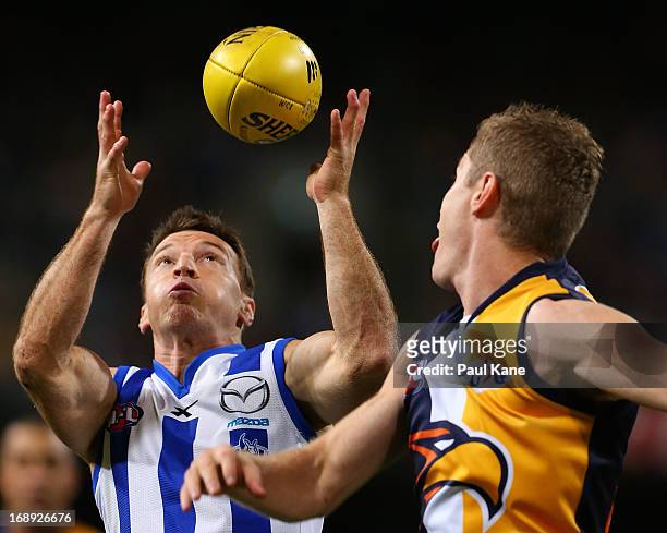 Brent Harvey of the Kangaroos marks the ball against Adam Selwood of the Eagles during the round eight AFL match between the West Coast Eagles and...