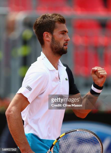 Benoit Paire of France celebrates winning a point during his quarter final match against Marcel Granollers of Spain on day six of the Internazionali...