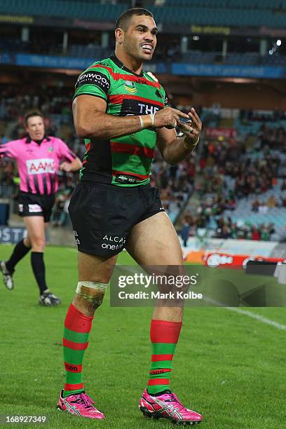 Greg Inglis of the Rabbitohs counts his tries as he celebrates scoring a try during the round 10 NRL match between the South Sydney Rabbitohs and the...