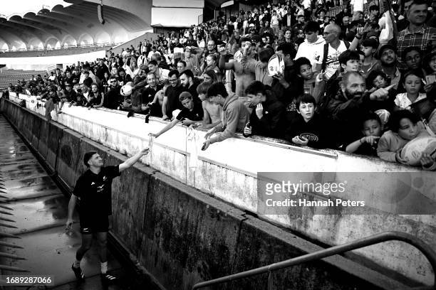 Jordie Barrett of the All Blacks signs autographs following a New Zealand All Blacks training session at Stade Jacques-Chaban-Delmas on September 18,...