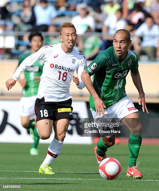 Naohiro Takahara of Tokyo Verdy and Hideo Tanaka of Vissel Kobe compete for the ball during the J.League second division match between Tokyo Verdy...
