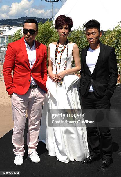 Donnie Yen, Eva Huang and Wang Boaqiang attend the 'Iceman Cometh 3D' Photocall and Press conference at the 66th Annual Cannes Film Festival on May...