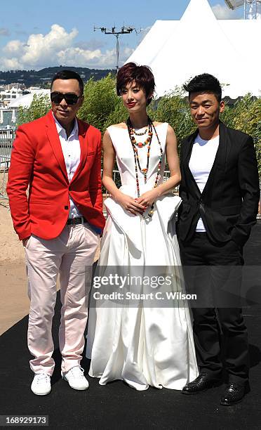 Donnie Yen, Eva Huang and Wang Boaqiang attend the 'Iceman Cometh 3D' Photocall and Press conference at the 66th Annual Cannes Film Festival on May...