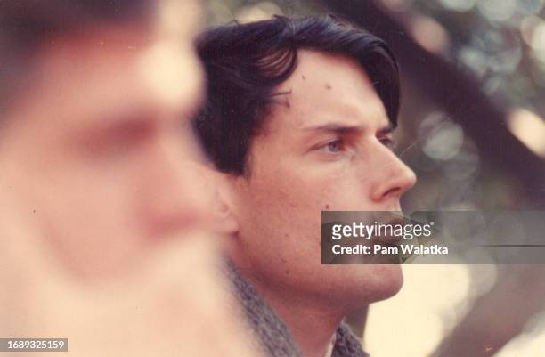 Close-up of American author and Esalen Resident Fellow John Heider at the Esalen Institute, Big Sur, California, 1967. Out of focus in foreground is...