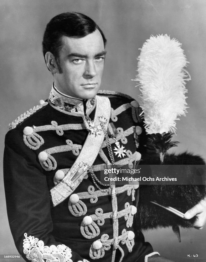Richard Johnson wearing a military uniform and holding a feathered ...