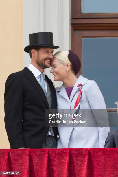 Crown Prince Haakon, and Crown Princess Mette-Marit of Norway, watch the annual Norwegian National Day parade from the balcony of The Royal Palace in...