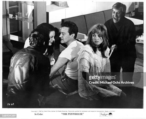Suzy Kendall, Terence Morgan and Norman Rodway in a scene from the film 'The Penthouse', 1967.