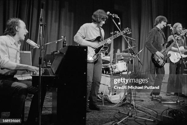 English rock group Brinsley Schwarz performing on stage, 4th May 1973. Left to right: Bob Andrews, Brinsley Schwarz, Nick Lowe and Ian Gomm.