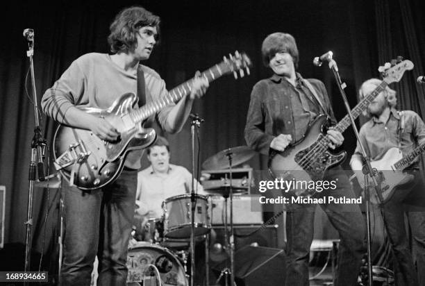 English rock group Brinsley Schwarz performing on stage, 4th May 1973. Left to right; Brinsley Schwarz, Billy Rankin, Nick Lowe and Ian Gomm.
