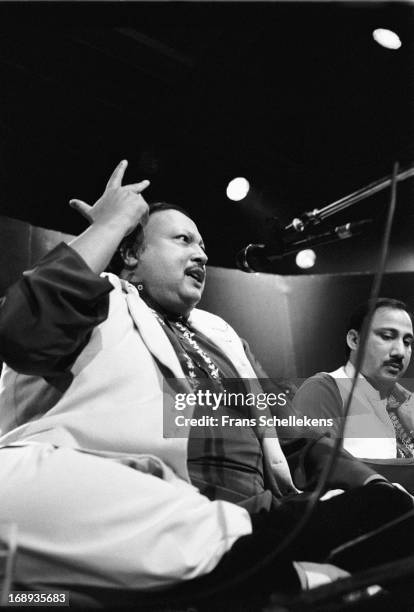 Pakistani musician Nusrat Fateh Ali Khan performs live on stage at the Melkweg in Amsterdam, Netherlands on 28th February 1988.