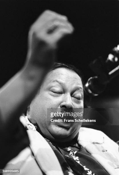 Pakistani musician Nusrat Fateh Ali Khan performs live on stage at the Melkweg in Amsterdam, Netherlands on 28th February 1988.