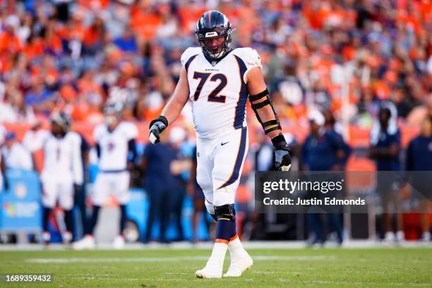 Offensive tackle Garett Bolles of the Denver Broncos walks on the field during the fourth quarter against the Washington Commanders at Empower Field...