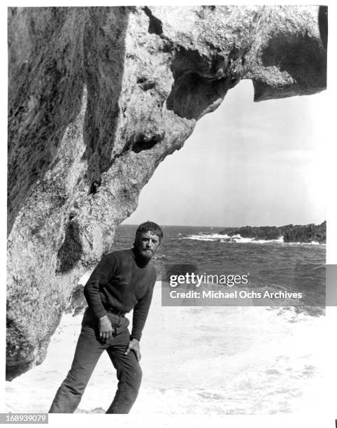 Kirk Douglas on the beach in a scene from the film 'The Light At The Edge Of The World', 1971.