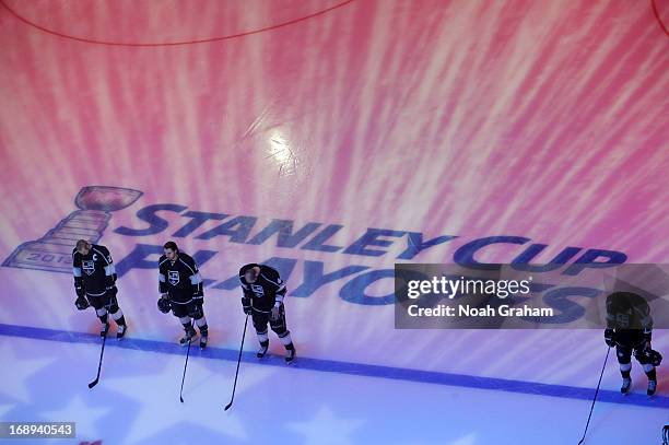 The Los Angeles Kings stand on the ice prior to the game against the St. Louis Blues in Game Six of the Western Conference Quarterfinals during the...