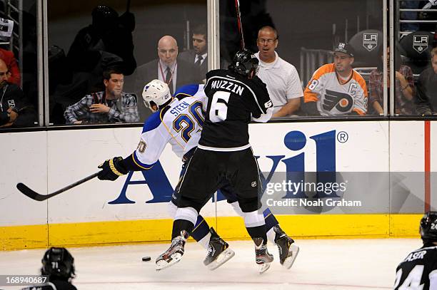 Jake Muzzin of the Los Angeles Kings throws the check against Alexander Steen of the St. Louis Blues in Game Six of the Western Conference...