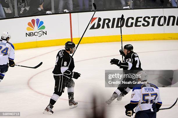 Drew Doughty and Tyler Toffoli of the Los Angeles Kings react after a goal against the St. Louis Blues in Game Six of the Western Conference...