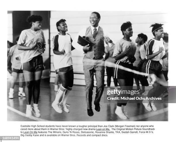 Morgan Freeman jumps rope with students in a scene from the film 'Lean On Me', 1989.