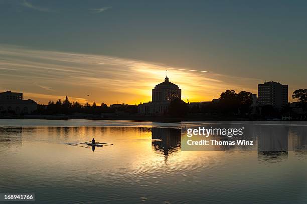 rower at lake merritt - alameda county stock pictures, royalty-free photos & images