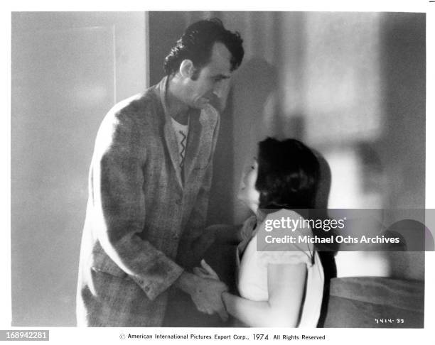 Jesse Vint holds Joan Blackman in a scene from the film 'Macon County Line', 1974.