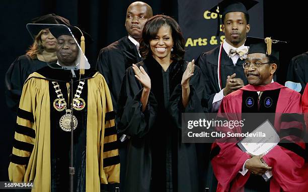 First lady Michelle Obama joins Bowie State University President Mickey Burnim and Provost Weldon Jackson on stage for the university's graduation...