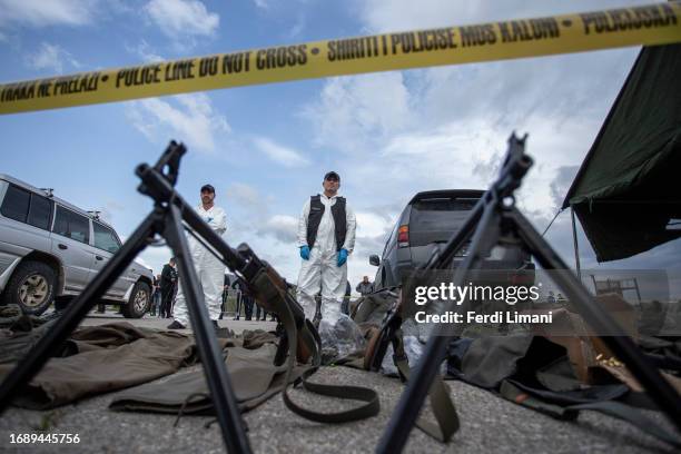 Kosovo Police officers at the Belvedere Police station during the display of weapons and supplies that were confiscated from an armed group on...