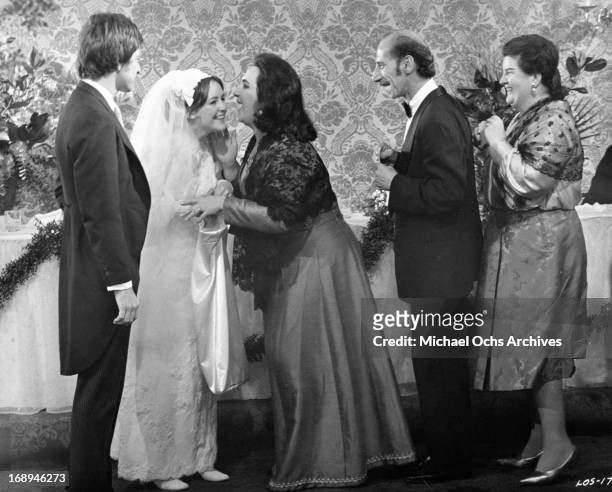 Michael Brandon and Bonnie Bedelia are greeted by their wedding guests in a scene from the film 'Lovers And Other Strangers', 1970.