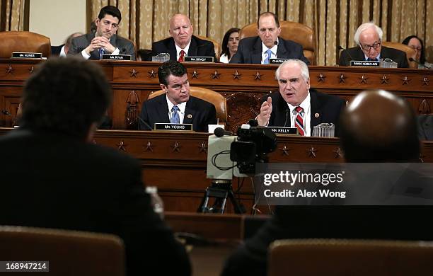 Rep. Mike Kelly speaks as Rep. Todd Young , Rep. Paul Ryan , Rep. Kevin Brady , Committee Chairman Rep. Dave Camp and ranking member Rep. Sander...