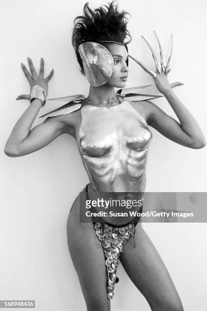 An unidentified fashion model poses in works by jewelry designer Robert Lee Morris, 1987.