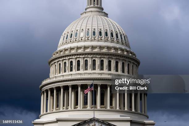 Dark clouds hang above the U.S. Capitol dome on Monday, September 25, 2023.