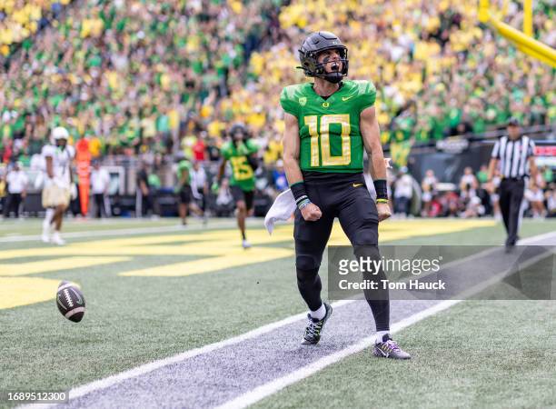 Quarterback Bo Nix of the Oregon Ducks celebrates a touchdown against the Colorado Buffaloes during the first half at Autzen Stadium on September 23,...
