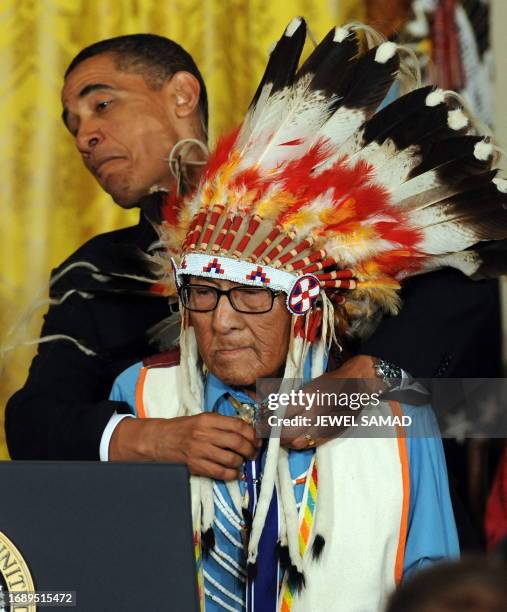 President Barack Obama awards Joseph Medicine Crow High Bird the Presidential Medal of Freedom during a ceremony in the East Room at the White House...