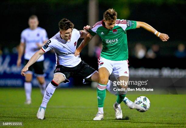 Louth , Ireland - 25 September 2023; Andrii Kravchuk of Cork City in action against Alfie Lewis of Dundalk during the SSE Airtricity Men's First...