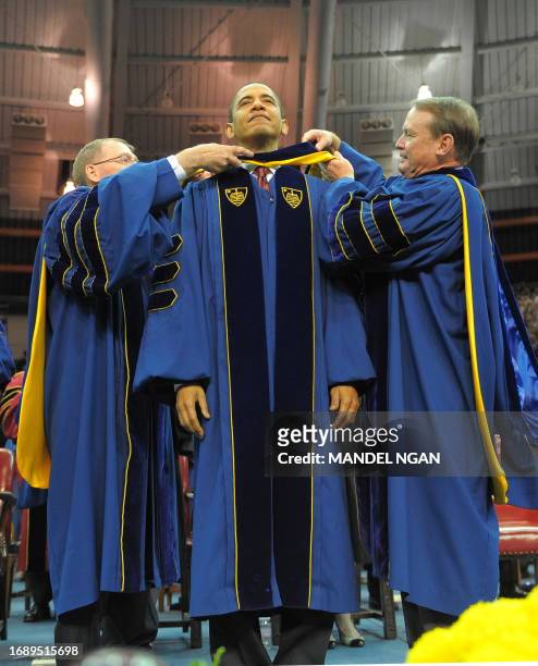 President Barack Obama receives an honorary doctor of laws degree May 17, 2009 during the commencement ceremony in the Joyce Center of Notre Dame...