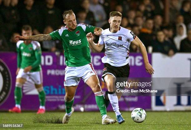 Louth , Ireland - 25 September 2023; John Martin of Dundalk in action against Ally Gilchrist of Cork City during the SSE Airtricity Men's Premier...
