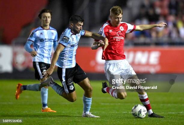 Dublin , Ireland - 25 September 2023; Alex Nolan of St Patrick's Athletic in action against Luke Heeney of Drogheda United during the SSE Airtricity...