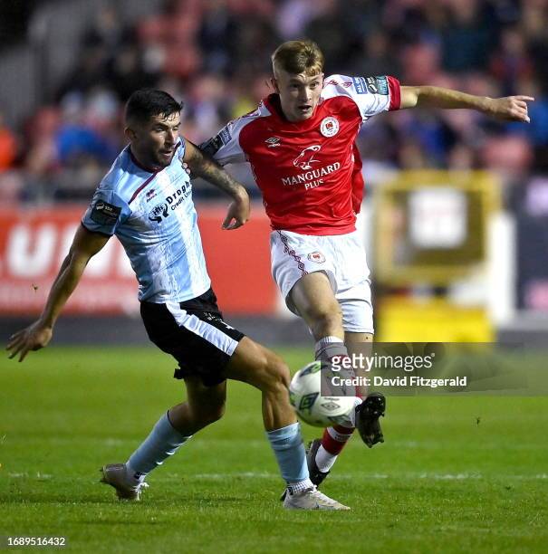 Dublin , Ireland - 25 September 2023; Alex Nolan of St Patrick's Athletic in action against Luke Heeney of Drogheda United during the SSE Airtricity...